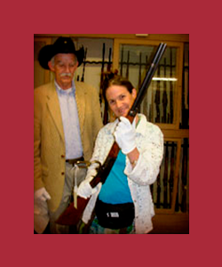 Jill Jonnes holds rifle once owned by Annie Oakley.