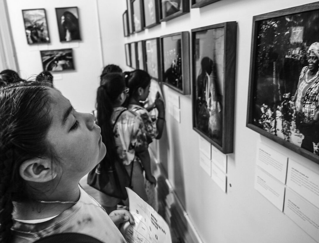 Student on class visit to Bronx Documentary Center show of Ecuadorean photographer Johis Alarcon’s “Cimarrona,” images of Afro-Ecuadorean women. (Bronx Documentary Center)
